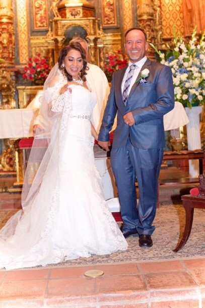 Wedding photo of a woman and man at the church altar.